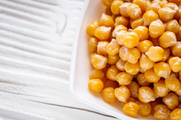 boiled chickpeas on a white wooden rustic background