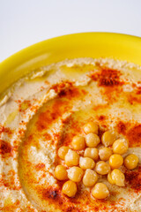 traditional turkish hummus on a white acrylic background