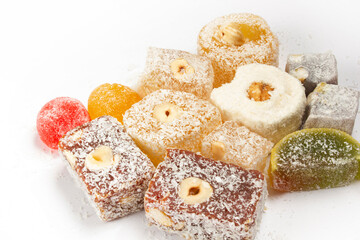 The traditional Turkish dessert Cezerye with hazelnuts. Lokum, Turkish delight.