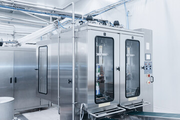 Dairy factory, plastic bags of packaged milk in automatic filling conveyor
