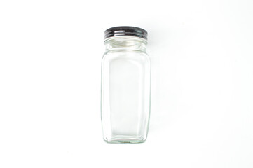 Empty glass jar over white background.