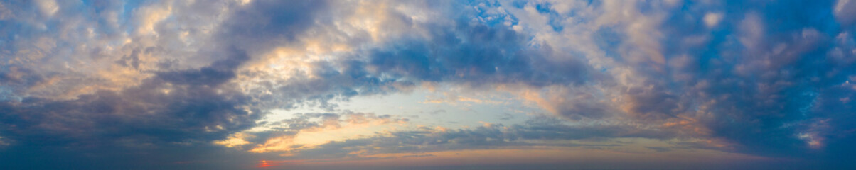 Naklejka na ściany i meble Natural background of the colorful panorama sky. Beautiful cloud in the sunrise sky background. Sky banners background.