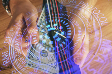 Double exposure of technology drawing hologram and us dollars bills and man hands. Data concept