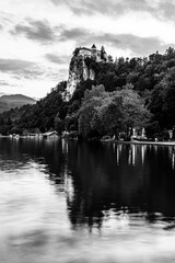 Twilight view of the castle of Bled with reflections onto Lake Bled. Medieval Bled castle in Slovenia