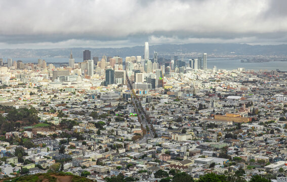 View of the city of San Francisco from Twin Peaks on a cloudy day with clouds. Concept, picture for postcards, travel, guide.