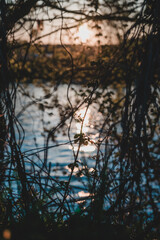 sunset over the river with reflection on the water
