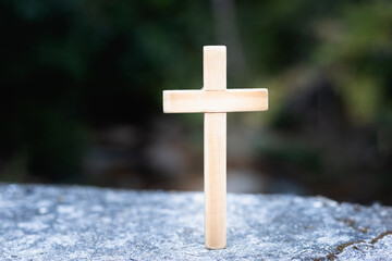 The cross rests on the cement floor. Natural background It is a request for blessing from God, the power of holiness. It represents forgiveness by faith, worshiping the thought.