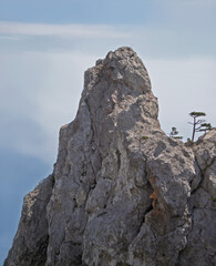 Lonely rock against the blue sky