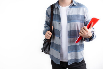 Casual wear content young man posing with backpack and textbook. Student and education concept, isolated on white background.