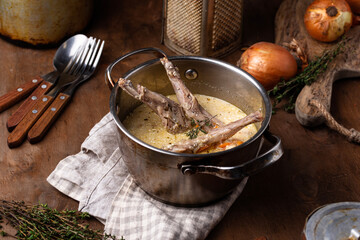 Stewed rabbit legs with sour cream