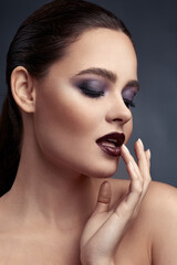 Beauty portrait of woman with smokey eyes make-up