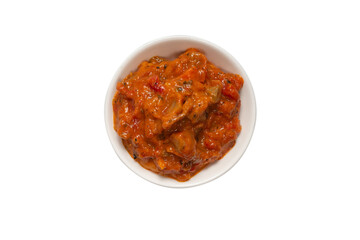Vegetable stew in a bowl isolated on white background.