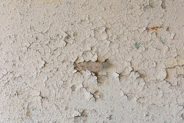 Background of the old wall in the abandoned apartment. Old paint cracked