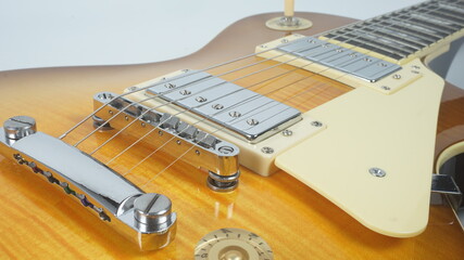 Electric guitar body detail, close-up view.