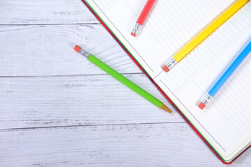 Close up of colorful pencils on notepad 