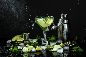 Gin-tonic alcoholic cocktail. liquor, ice. Freeze motion, drops in liquid splash