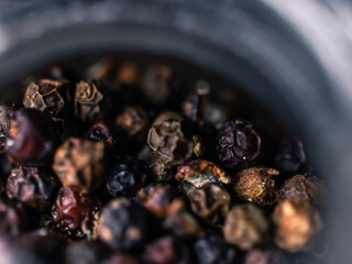 close up of black peppercorns