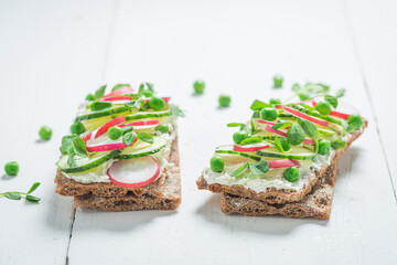 Spring sandwich with creamy cheese on crispy bread