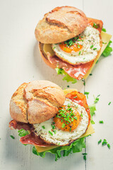 Homemade burger with fried egg, bacon and cheese