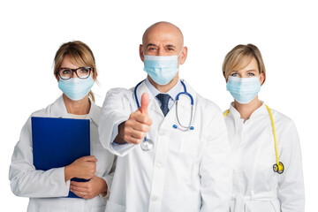 Group of medical people standing together at isolated background while male doctor giving thumbs up