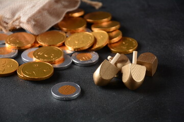 Hanukkah Chocolate shekel Coins. Delicious chocolate shekels in golden package. Hanukkah gelt with menorah.