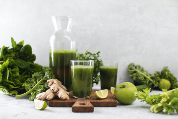 Green detox smoothies with fresh leafy vegetables and ginger