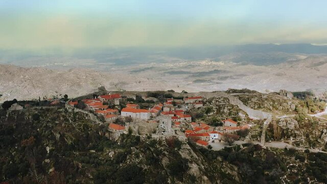 mountainous medieval historical city inside castle walls, dolly out aerial