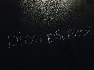 God is Love writing in Spanish