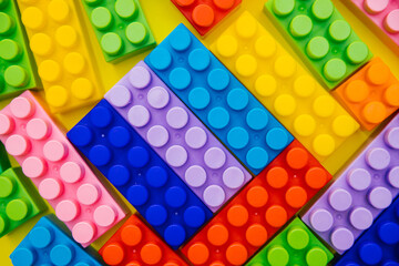 Colorful children's construction kit. Background of the constructor details.