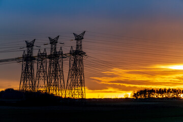 High voltage electric tower on sunset time and sky on sunset background. Power Tower