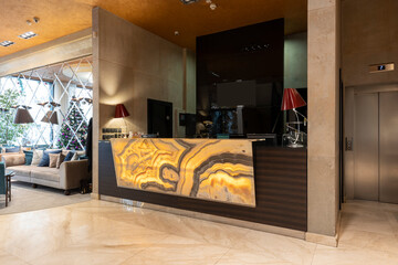 Marble reception desk in hotel lobby