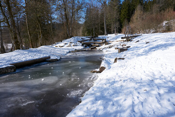 A frozen river on a sunny day in winter