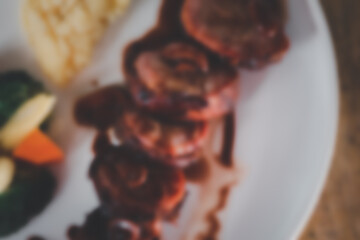 Blur background of pork fillet wrapped in bacon