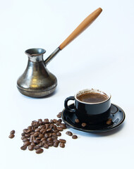 Coffee beans, a coffee cup, and a coffee turk.
