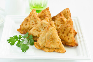 Asian food. Vegetarian samsa (samosas) with tomato sauce