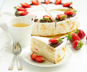 Sponge cake with strawberries and cream. Selective focus.