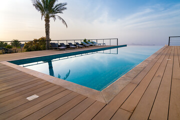 Infinity pool in a resort of arabian desert. Luxury resort in Oman.