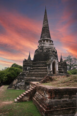 Fototapeta premium ancient old pagoda was built from laterite in thai temple with twilight sky at ayutthaya