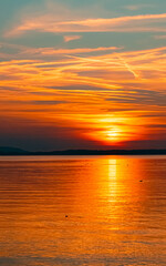 Fototapeta na wymiar Beautiful sunset with reflections at the famous Chiemsee, Chieming, Bavaria, Germany