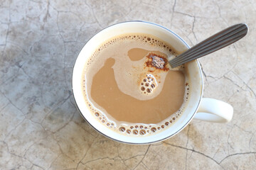 Hot coffee in a white mug ready to drink