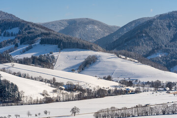 Naklejka premium beautiful view over kirchzarten and oberried towards the popular mountains of the black forest stollenbach and hinterwaldkopf