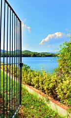 Open gate overlooking Lake Banyoles in the province of Girona, Catalonia, Spain