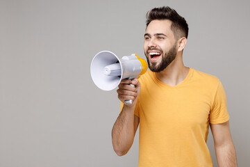 Young caucasian smiling bearded attractive active leader happy man 20s weering casual yellow basic...