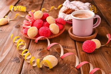 Espersso coffee Traditional sweet pastries during the carnival period in italy. Street food, round biscuits with sugar for the carnival of Venice.  horizontal photo