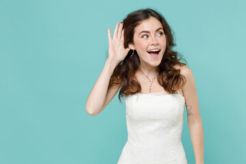 Amazed curious bride young woman in beautiful white wedding dress try to hear you overhear...