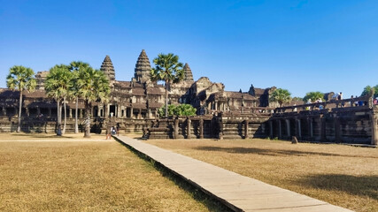 Naklejka premium Road to Angkor Wat. Old Khmer Temple in ancient ruins. Unesco World Heritage Site. Siem Reap Province. Cambodia. South-East Asia