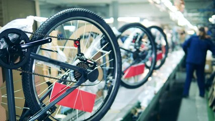 Close up shot of a bicycle production line at a factory