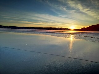 sunrise on a frozen lake