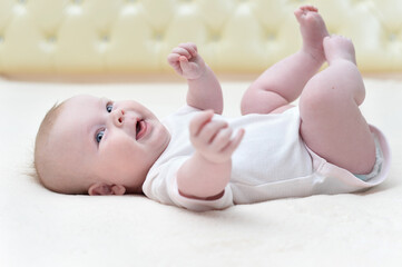 cute newborn baby girl lying on her back