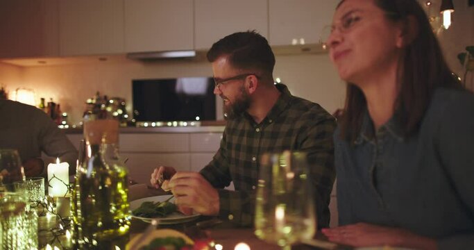 Couple laughing during a
dinner party
